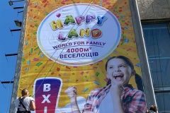 монтаж банера, висотні роботи на фасад будинку для HAPPY LAND